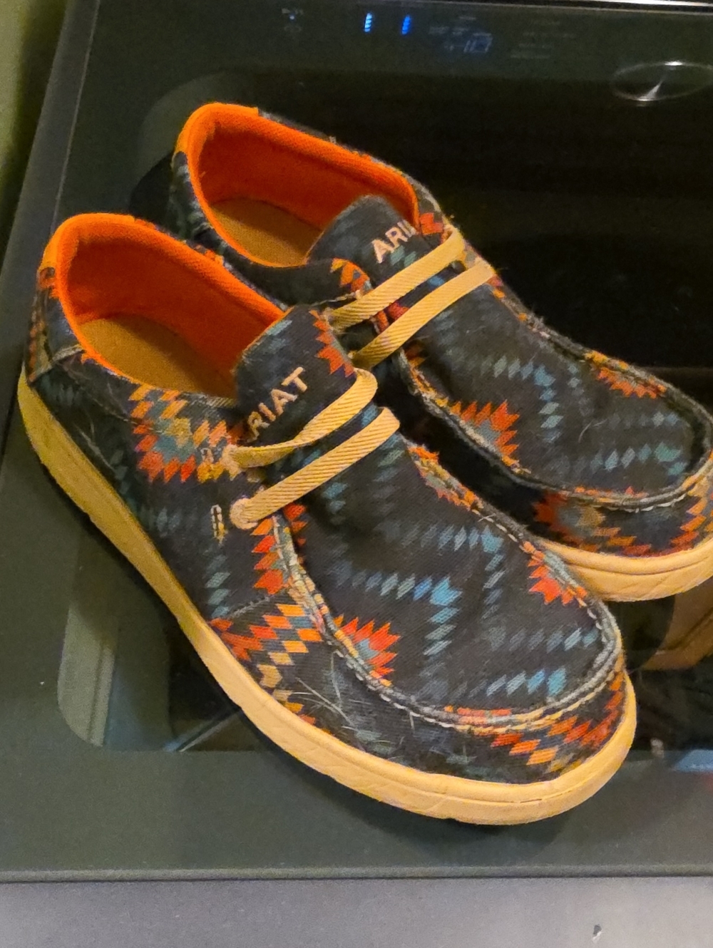 Ariat Kids Black Geometric Slip-On Sneakers with Orange Accents